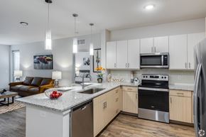 Clermont apartment for rent - A modern kitchen with a granite countertop and stainless steel appliances.