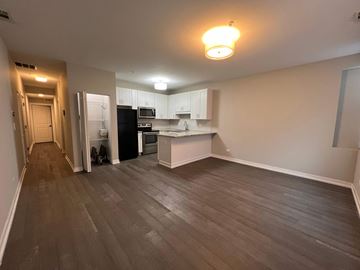 Chicago apartment for rent - A kitchen with a black refrigerator and a black oven.