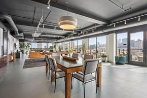 Chicago apartment for rent - A modern dining room with a long table and chairs.