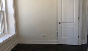 Chicago apartment for rent - A white door is on the right side of the image.