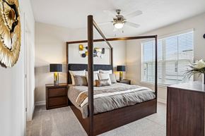 Tavares apartment for rent - A bedroom with a large bed and a ceiling fan.