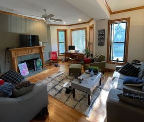 Chicago apartment for rent - A living room with a fireplace and a television.