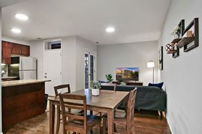 Chicago apartment for rent - a dining room and living room with a table and chairs