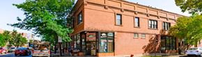 Chicago apartment for rent - a brick building on the corner of a city street