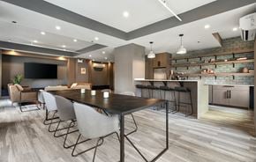 Chicago apartment for rent - a communal area with a table and chairs and a kitchen