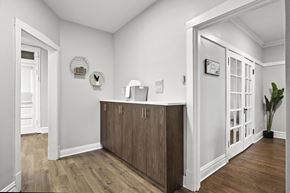 Chicago apartment for rent - a living room with a counter and a door into a hallway