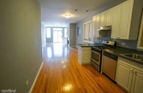 Chicago apartment for rent - an empty kitchen and living room with a wood floor