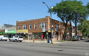 Chicago apartment for rent - a brick building on the corner of a city street