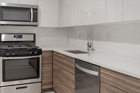 Chicago apartment for rent - A modern kitchen with a stainless steel dishwasher and microwave above the stove.