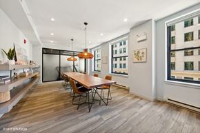 Chicago apartment for rent - a dining room with a wooden table and chairs
