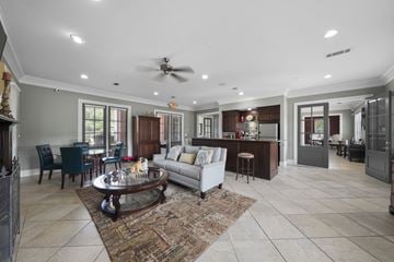Lafayette apartment for rent - A spacious living room with a fireplace and a rug on the floor.