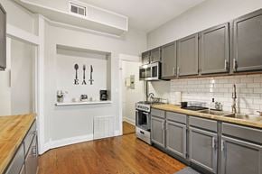Chicago apartment for rent - a kitchen with stainless steel appliances and a wood floor