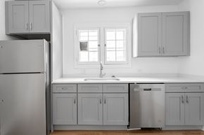 Chicago apartment for rent - A kitchen with a refrigerator, sink, and cabinets.