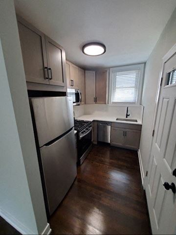 Chicago apartment for rent - a small kitchen with a refrigerator and a sink