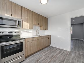 Chicago apartment for rent - A kitchen with a stove, oven, and microwave.