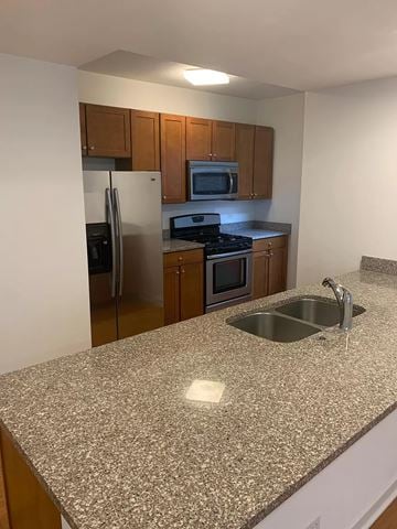 Chicago apartment for rent - a kitchen with a granite counter top and a sink