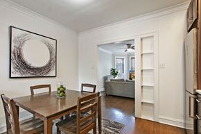 Chicago apartment for rent - A dining room with a wooden table and chairs.