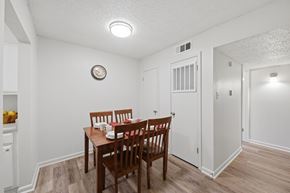 Lafayette apartment for rent - A dining room with a wooden table and chairs.