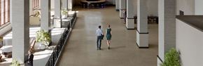 Hammond apartment for rent - a man and a woman are walking through an empty building