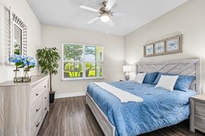 Tavares apartment for rent - A bedroom with a bed, dresser, and window.