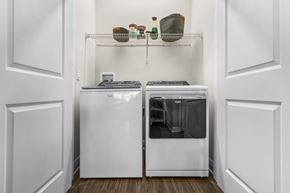 Tavares apartment for rent - A white kitchen with a dishwasher and a refrigerator.