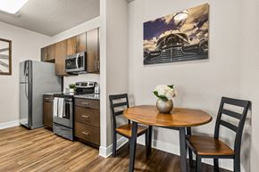 Tavares apartment for rent - A kitchen with a table and chairs and a fridge.