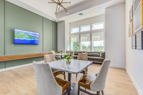 Mount Dora apartment for rent - A modern dining room with a glass table and chairs.