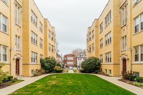 Chicago apartment for rent - a green lawn in the middle of some apartment buildings