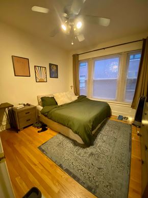 Chicago apartment for rent - A bedroom with a bed, dresser, and window.