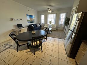 Clermont apartment for rent - A black table with four chairs is in the middle of a kitchen and dining room.