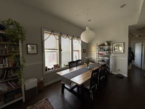 Chicago apartment for rent - A dining room with a long table and chairs.