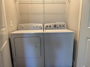Full size side by side washer and dryer included in every unit