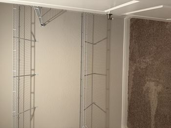 Spacious walk in closets with built in shelving