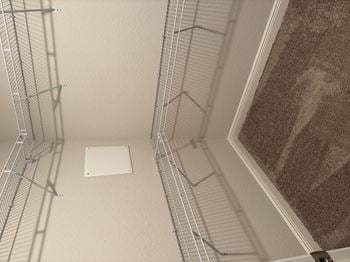 Spacious walk in closets with built in shelving