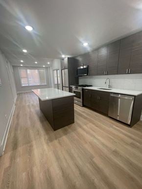 Chicago apartment for rent - a kitchen with an island and stainless steel appliances