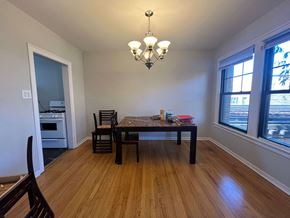 Chicago apartment for rent - A dining room with a table and chairs.