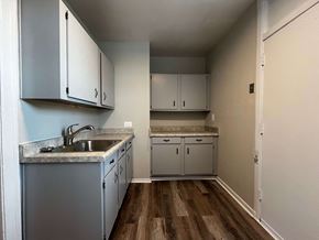 Chicago apartment for rent - A kitchen with a sink and cabinets.