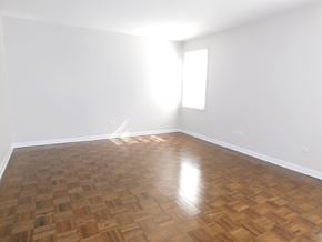 Evanston apartment for rent - A room with wooden flooring and a window letting in sunlight.
