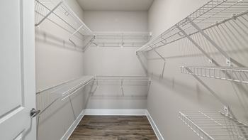 Spacious walk-in closets with custom shelving