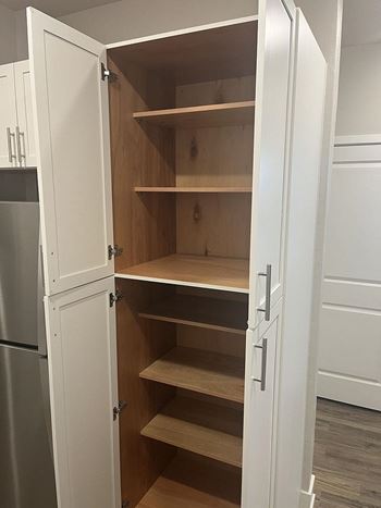 Built-in kitchen pantry with double doors