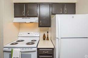 Lafayette apartment for rent - A kitchen with a white fridge, white stove and white oven.
