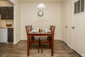 Lafayette apartment for rent - A dining room with a wooden table and chairs.