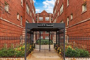 Chicago apartment for rent - The gate of 5111-21 W. Montrose is black and has a sign above it.