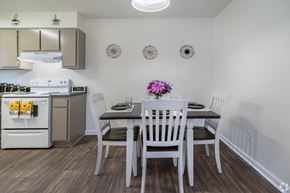 Orange Park apartment for rent - A kitchen with a table and chairs set for two.