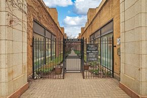 Chicago apartment for rent - a gate with a sign on it in front of a building