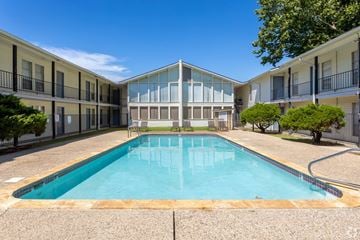 Lafayette apartment for rent - A swimming pool in a courtyard surrounded by buildings.