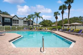 Naples apartment for rent - Community Swimming Pool with Pool Furniture at Waverley Place Apartments in Naples, FL.