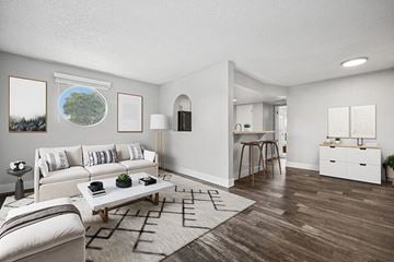 Glendale apartment for rent - A living room with a white couch and a coffee table.