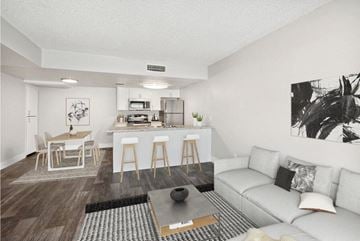 Mesa apartment for rent - a living room and kitchen with a couch and a table