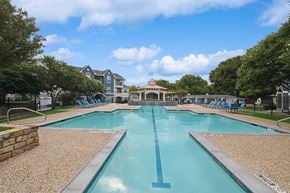 Lewisville apartment for rent - Community Swimming Pool with Pool Furniture at Hidden Creek Apartments located in Lewisville, TX.